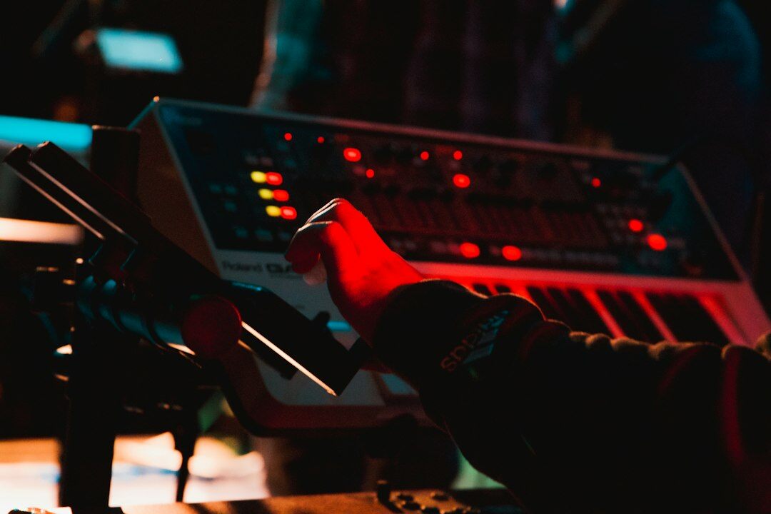 Hands operating a video vision mixer switcher panel